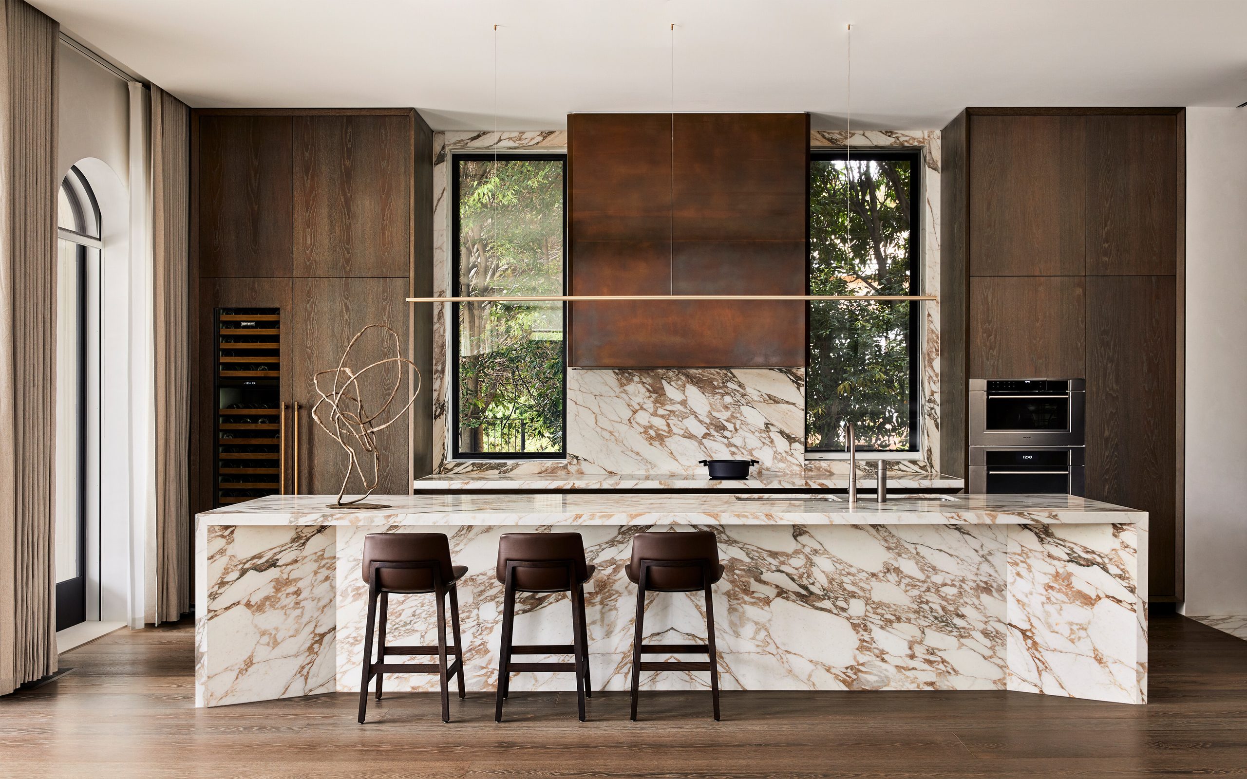 Mel Residence kitchen — Wolf wall ovens and Sub-Zero wine column